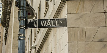 A Shot from within the city of the sign of the Wall St