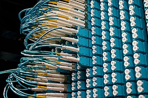 Fibre optic cables link servers in a data centre.