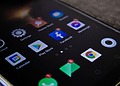 Detailed view of a smartphone screen with popular app icons including Facebook and Messenger.