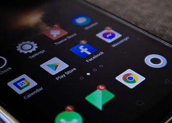 Detailed view of a smartphone screen with popular app icons including Facebook and Messenger.