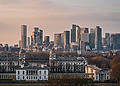 A view of the London skyline from Greenwich Park at sunset.