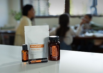 A selection of essential oil products displayed indoors, focused on wellness.