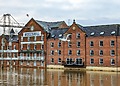 Floodwater rises against brick buildings at Woodsmill Quay in York.