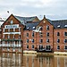 Floodwater rises against brick buildings at Woodsmill Quay in York.