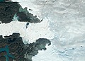 Satellite images from 2022 (Main image) and 1985 (Figure A) capture the retreat of Jakobshavn Isbrae, a glacier on Greenland's western coast, as icebergs broke off its edge over nearly four decades.