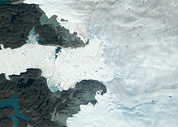 Satellite images from 2022 (Main image) and 1985 (Figure A) capture the retreat of Jakobshavn Isbrae, a glacier on Greenland's western coast, as icebergs broke off its edge over nearly four decades.