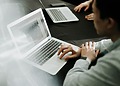 Man using a laptop protected by automatic logout security