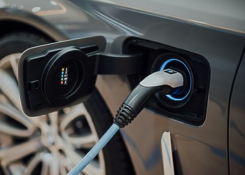 Charging cable connected to an electric vehicle port.
