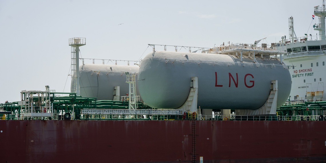 Storage tanks marked LNG on board a vessel.
