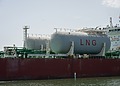 Storage tanks marked LNG on board a vessel.