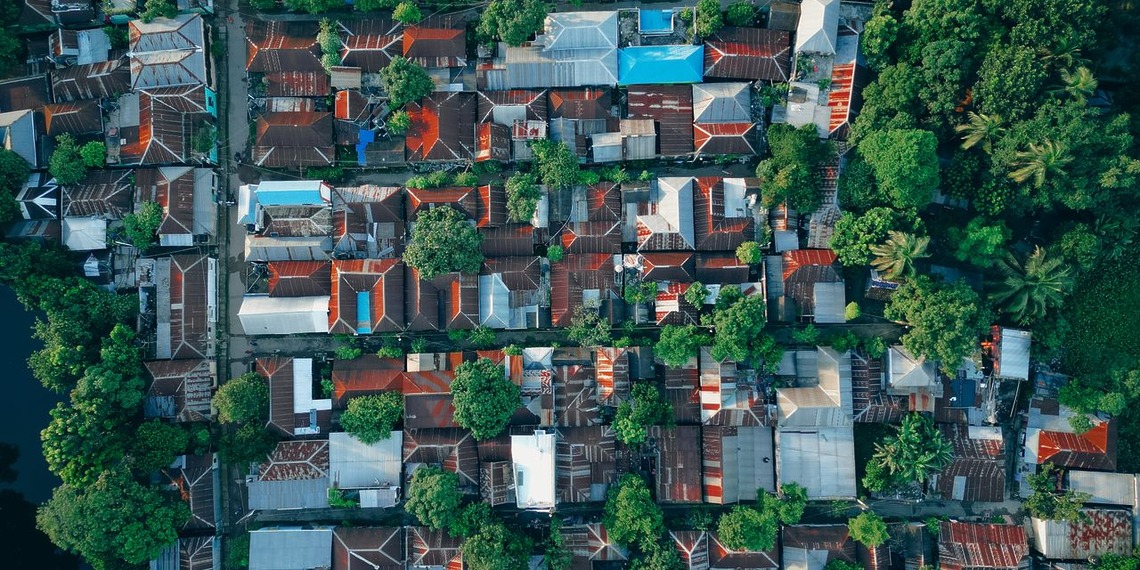 Colorful rooftops and greenery in Bangladesh.