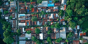 Colorful rooftops and greenery in Bangladesh.