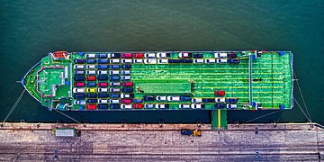 Aerial view of cars loaded on a car carrier ship.