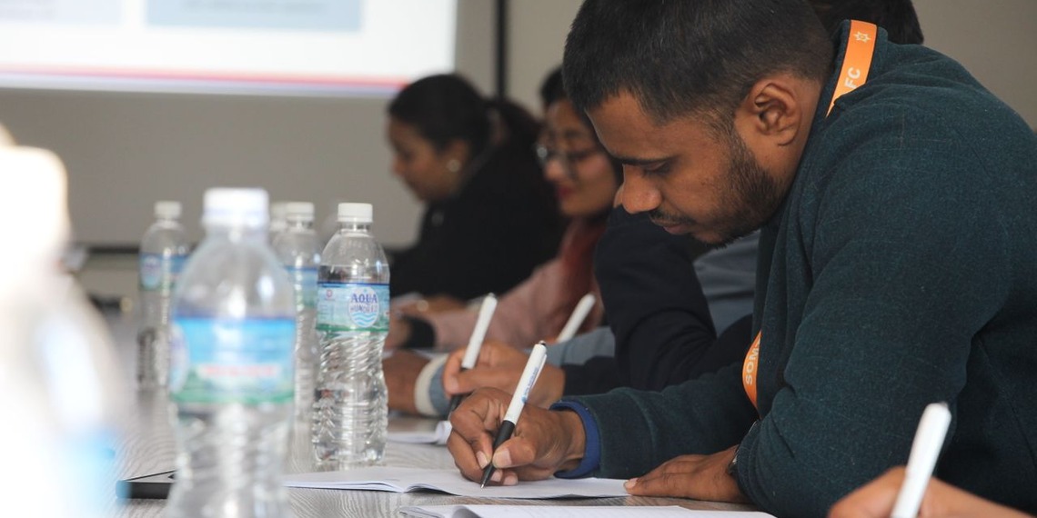 Business students participating in an interactive university seminar