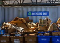Recycling containers marked for recyclable waste at a waste facility