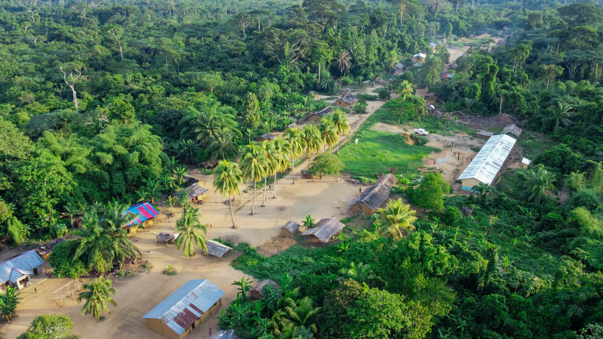 An aerial shot of a forest village in the DRC